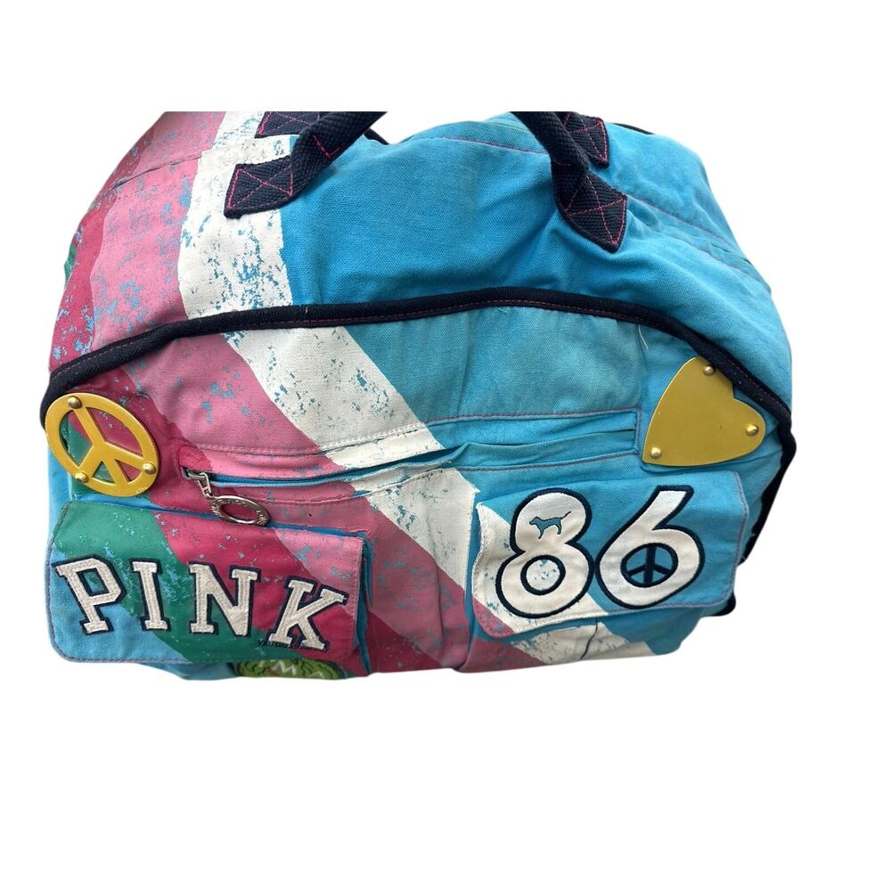 PINK Vintage Rare VS Peace University rolling Duffle luggage bag 2007

Years